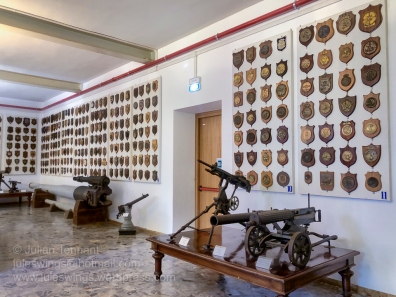 Various armaments and ships plaques on display at Venice's Museo Storica Navale