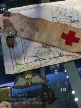 Watch, map, British medic's brassard, British para qualification wing and plastic economy issue Royal Army Medical Corps beret badge.