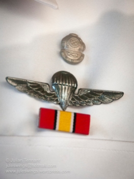 Royal Malaysian Navy Museum (Muzium Tentera Laut Diraja Malaysia). Sailor's uniform detail showing both the basic parachute and diving qualification badges. I am not sure which medal the ribbon represents.