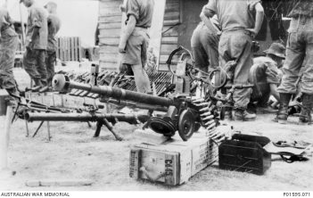 Weapons captured by the Australians during Operation CRIMP. The machine gun in the foreground is a Soviet DShk 12.7mm Heavy Machine Gun. Photograph: Alexander 'Sandy' MacGregor. Australian War Memorial Collection Accession Number: P01595.071
