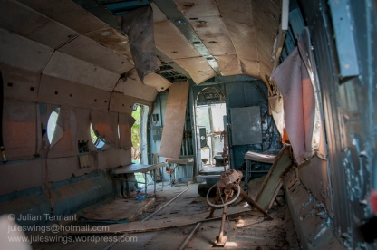 The wrecked and dilapidated interior of the Mil Mi-8 transport helicopter at the War Museum Cambodia. Until recently very little effort had been made to protect or conserve the exhibits fueling speculation that despite the museum's stated aim of preserving the history and memory of Cambodia's three decades of war, it was little more than a cash-cow for government officials seeking to extract money from visiting tourists. Photo: Julian Tennant