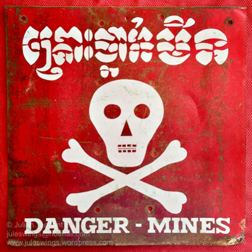 Older 1993 era metal Cambodian Minefield Warning sign. Collection: Julian Tennant