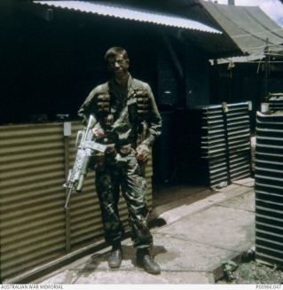 Trooper Don Barnby a Member of Two Five patrol, 2 Squadron, Special Air Service Regiment on SAS Hill, Nui Dat, South Vietnam immediately prior to moving out on patrol. AWM Accession Number: P00966.047