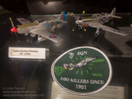 Model aircraft and patch of 77 Squadron RAAF. Photo: Julian Tennant