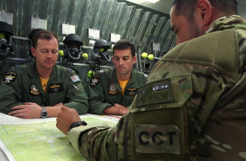 A Combat Control Team (CCT) member briefs the Offensive Air Support (OAS) plan to aircrew for a Close Air Support (CAS) mission as part of Exercise FARU SUMU 01-2012. Combat Controllers are essential for the successful integration of OAS to maximise available combat power and focus its effects in order to support the Commander's plan. Mid Caption: One hundred and forty Royal Australian Air Force (RAAF) personnel are in the Northern Territory, to participate in Exercise FARU SUMU 01-2012. Ten F/A-18F Super Hornets from RAAF Amberley's No. 6 Squadron and Combat Control Team (CCT) personnel from RAAF Williamtown's No 4 Squadron are participating in this exercise for the first time from 11-29 March 2012. Exercise FARU SUMU is used by the 6 Squadron instructional staff to test and evaluate the structure and format of the exercise to ensure the desired learning outcomes can be achieved on future FARU SUMU exercises with the new F/A-18F Super Hornets. Exercise FARU SUMU is conducted out of RAAF Darwin, Tindal and Delamere Weapons Range. Photo: LACW Kylie Gibson (ADF)