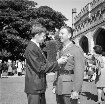 Government House, Sydney, NSW. 23 April 1971. It was a proud day for David Shilston of Wagga Wagga, NSW, when his father, Captain Peter Shilston was presented with the Military Cross (MC) by the Governor of NSW, Sir Roden Cutler, at Government House recently. Captain Shilston was awarded the MC in recognition of his exceptional bravery and leadership in Vietnam while serving with the Australian Army Training Team Vietnam (AATTV). Photo: Barry Buckley. AWM Accession Number BUC/71/0213/EC