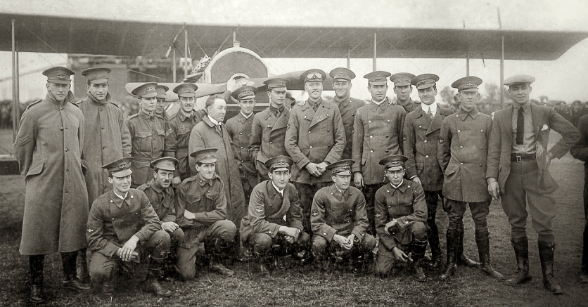 First student intake for the New South Wales State Aviation School, 28 August 1916. Back row, left to right: Nigel Love, who flew 200 hours over the front with 3 Sqn AFC; Garnsey Potts [briefly in 3AFC, invalided out due to sickness, thereafter instructing in England]; William L. King [joined 3AFC but crashed on a ferry flight with serious injuries, invalided to Australia]; Irving Sutherland [Royal Naval Air Service 10SQN, wounded in action]; Alan Weaver [joined 4AFC but soon seriously injured in a training accident]. Chief Instructor Billy Stutt (in centre, without cap); Augustus Woodward-Gregory [flew with 52SQN RAF, wounded in action, French Croix de Guerre]; John Weingarth [flew 151 missions over the lines in 4AFC Sopwith Camels, then instructing duties in England- died on a post-war training flight, 4 Feb 1919]; Jack Faviell [training and administration duties in England]; Edgar Coleman [joined RNAS, but dogged by illness and did not fly in combat]; Robert L. Clark [two months' combat with 2AFC, injured in an SE5A landing accident, thence instructing in England; died in WW2 as a civilian internee of the Japanese, when the Japanese POW ship Montevideo Maru was torpedoed by submarine USS Sturgeon on 1 July 1942]; Leslie Sampson [4AFC but suffered several accidents flying Camels and was grounded]; Roy Smallwood [combat with 4AFC for four months, shot down by German anti-aircraft fire, but survived]; Leonard Webber [left Richmond course but later saw action in Belgium]; and Charles Dagg [RNAS seaplane pilot, awarded Air Force Cross after he survived a wreck in the Mediterranean, died in WW2 serving in the RAF.] Front Row, left to right: Norman Clark [served with 3AFC for 9 months, pilot and Signals Officer, thence instructor in England, promoted to Captain and Flight Commander]; Cecil R. Burton [4AFC for two months, but invalided to England with illness]; Vernon Burgess [9SQN RFC and Flight Commander with 7SQN RFC on RE8s, shot down and wounded after six months in action, thence instruction duties]; Michael Cleary [served with 62SQN RFC, killed in action flying a Bristol Fighter, 28 March 1918 near Villers-Bretonneux, France]; Hector K. Tiddy [killed on a practice flight in France, 1917, 7SQN RFC]; and D. Reginald Williams [retained as an instructor at Richmond, then joined the AFC in England, but only employed ferrying new aircraft to France, due to medical restrictions.] Photo courtesy: The Nigel Love Photo Collection